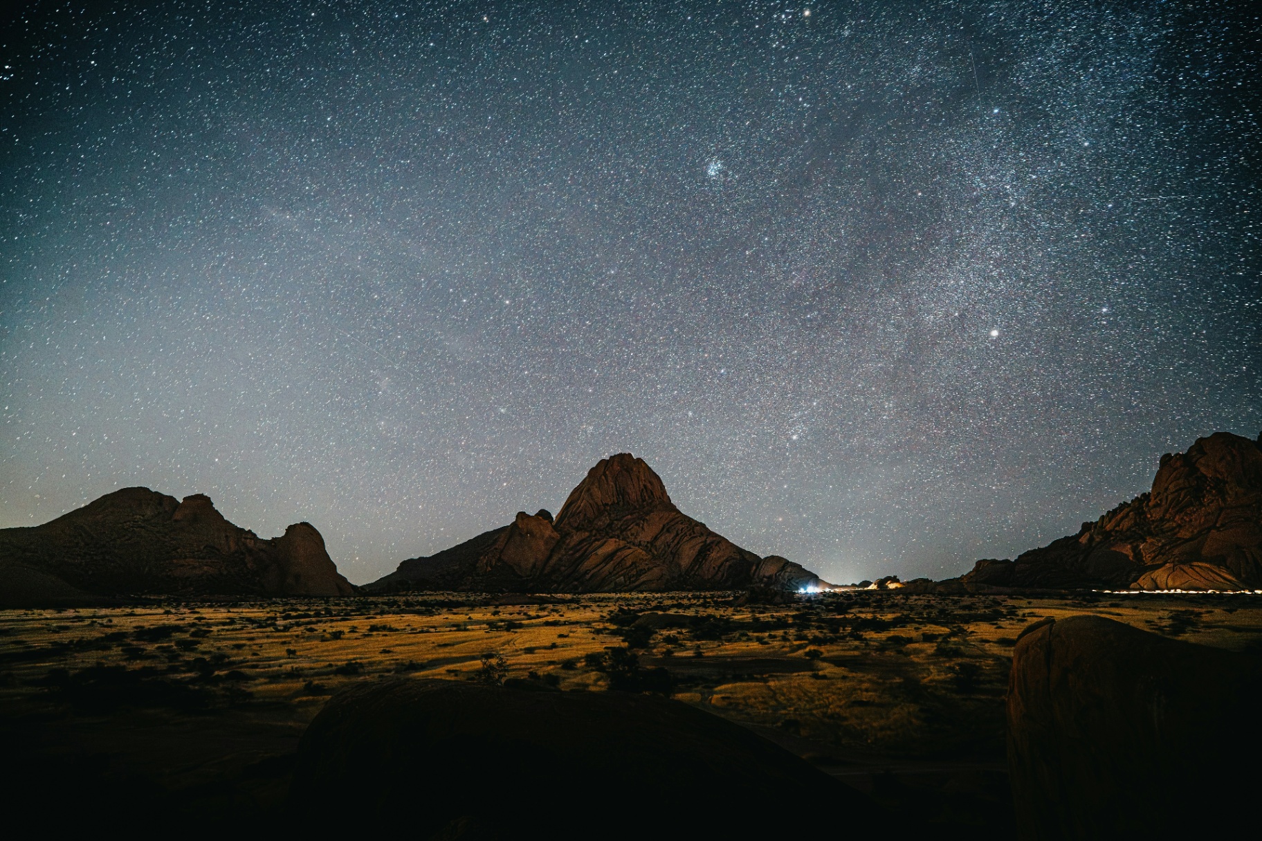 Milky Way over the granite peaks of the NamibRand at night.